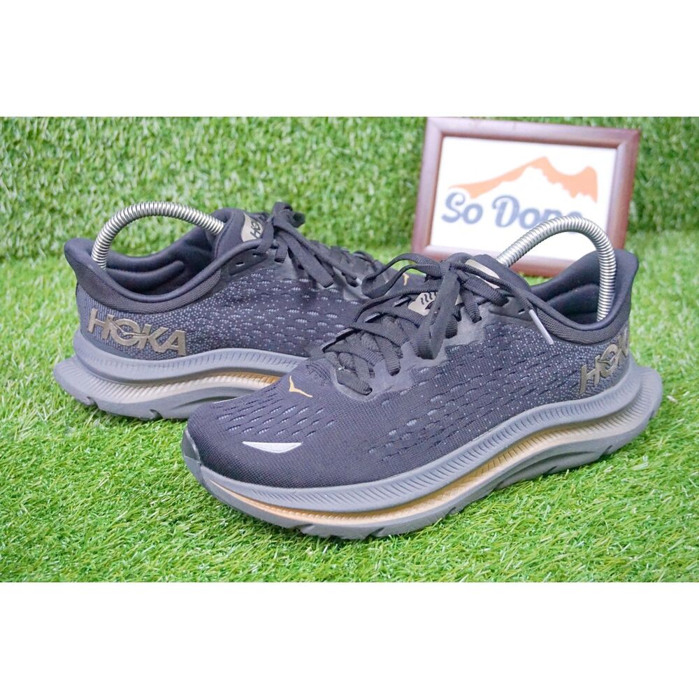 Hoka Black and Gold Athletic Shoes